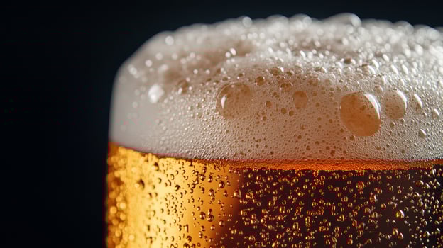 Close up of a beer glass with bubbles photo