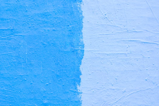 Blue paint texture. Interior of a modern loft. Abstract bright background. The facade of an old house. Divided in half. photo