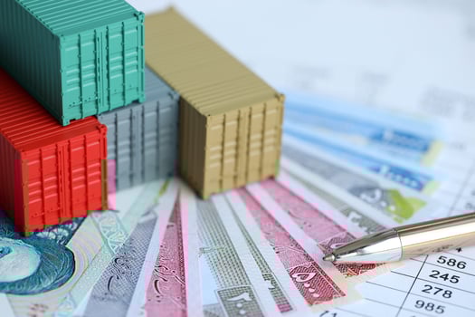 Company shipping cargo containers in Iran with rials money bills and pen photo