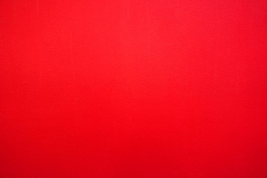Abstract red background. Red stucco texture. Red rough surface. photo