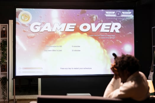 Upset man losing science fiction singleplayer game on gaming console, feeling sad. Player failing to win videogame, annoyed after being defeated by enemies and getting spaceship destroyed photo