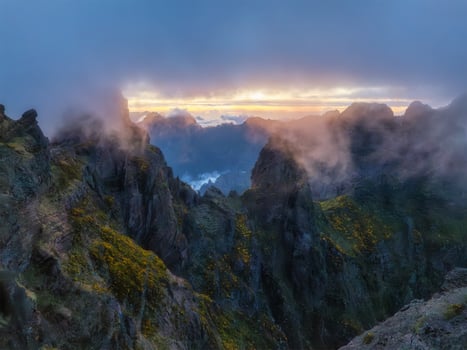 Mountains on sunset covered in fog and clouds. Madeira island, Portugal photo