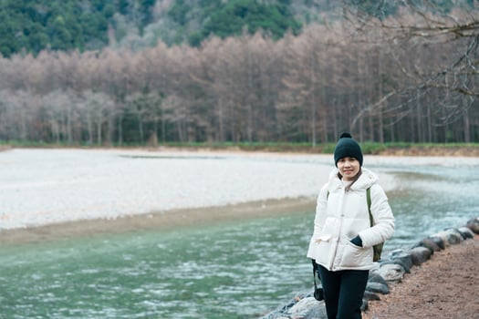 Woman tourist travel Kamikochi National Park, happy Traveler sightseeing Azusa river with mountain, Nagano Prefecture, Japan. Landmark for tourists attraction. Japan Travel, Destination and Vacation photo