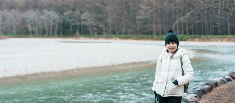 Woman tourist travel Kamikochi National Park, happy Traveler sightseeing Azusa river with mountain, Nagano Prefecture, Japan. Landmark for tourists attraction. Japan Travel, Destination and Vacation photo