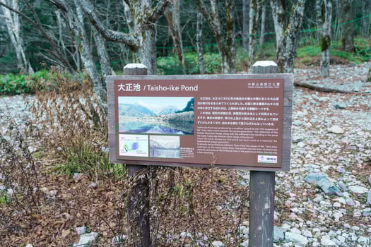 Kamikochi National Park, Taisho pond with Alps mountain, Nagano Prefecture, Japan. Landmark for tourists attraction. Japan Travel, Destination and Vacation concept photo