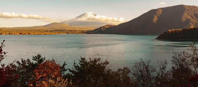 Mount Fuji at Lake Motosu in Autumn season. Mt Fujisan in Fujikawaguchiko, Yamanashi, Japan. Landmark for tourists attraction. Japan Travel, Destination, Vacation and Mount Fuji Day concept photo