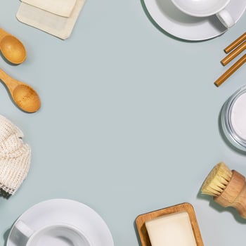 Dishes, bamboo dish brushes, natural cleaning products and accessories photo