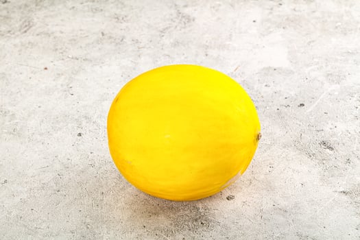 Sweet juicy whole yellow melon photo