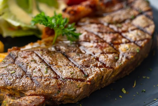 Grilled Sirloin Beef Steak with french fries and salads. photo
