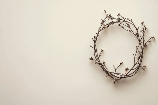 Minimalistic wreath lying on neutral background for holidays photo
