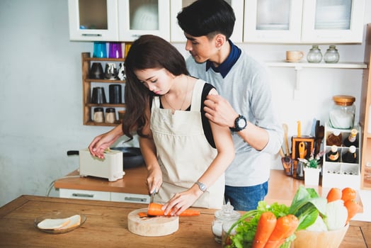 A happy family cooking together in a bright kitchen shows their happiness, teamwork, and love for home-cooked food, creating a warm and loving atmosphere at home. photo