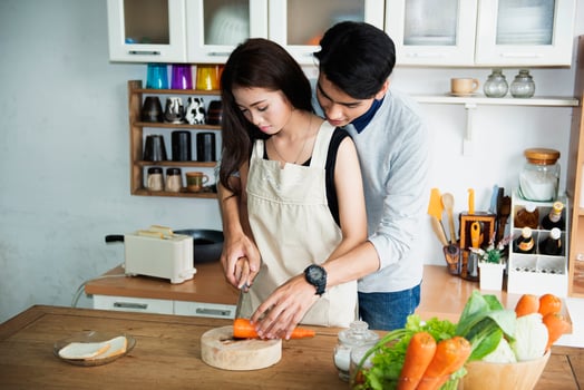 A happy family cooking together in a bright kitchen shows their happiness, teamwork, and love for home-cooked food, creating a warm and loving atmosphere at home. photo