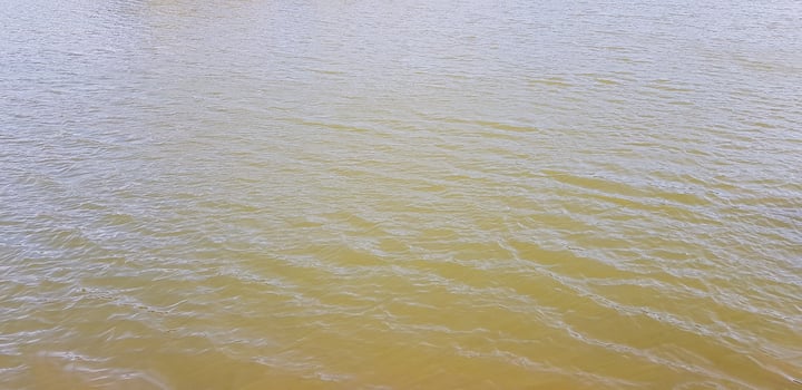 Beautiful river or lake and small wave from wind power for background at Jetkod Pongkonsao national park, Saraburi, Thailand. Beauty of Nature and Landmark for travel near Bangkok concept. photo