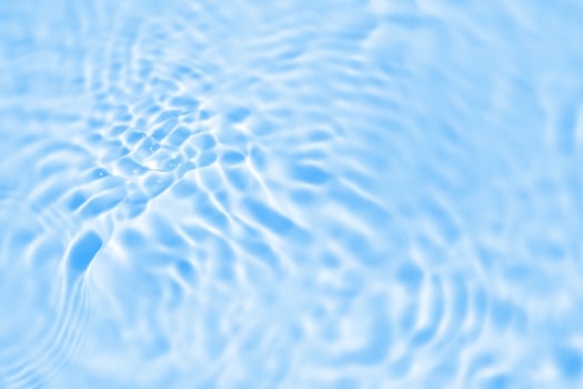 Abstract transparent water shadow surface texture natural ripple on blue background photo