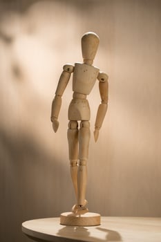 An artist wooden mannequin stands poised, ready to inspire creators with its lifelike articulation and elegant design. photo