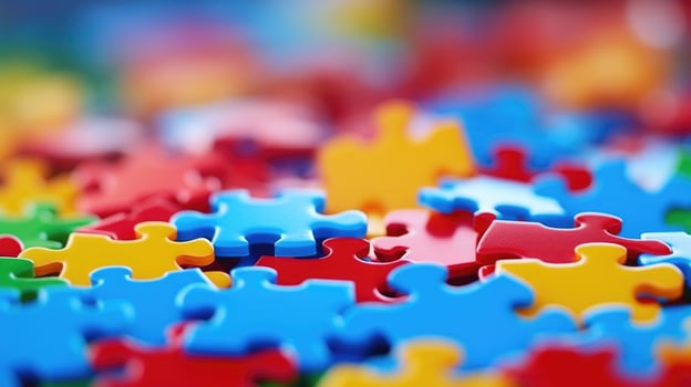 Closeup of a group of colorful puzzle pieces fitting together, representing collaboration and problemsolving. photo