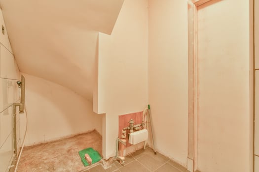 A bathroom with a toilet and a shower photo