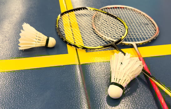 Racket and Shuttlecock with use sport or exercise on a black background. photo