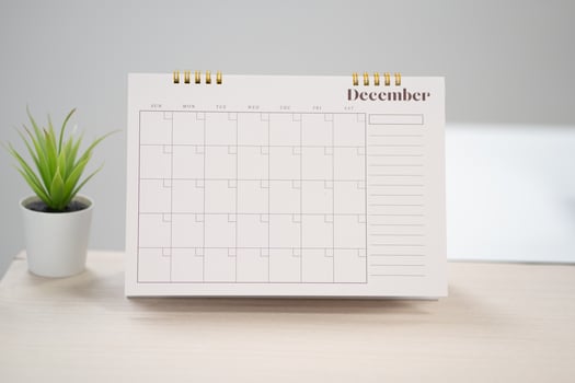 Desk calendar for December on the table with copy space in work space concept. photo