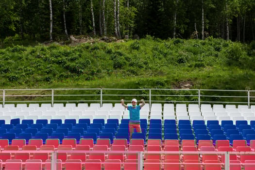 Lonely boy on the empty stadium outdoor photo