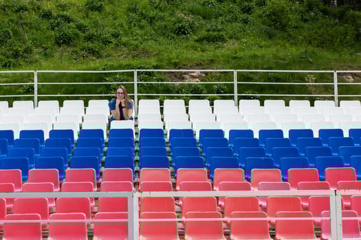 Lonely woman on the empty stadium outdoor photo