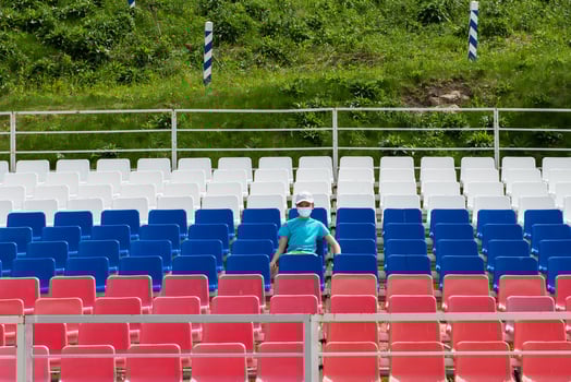 Lonely boy on the empty stadium outdoor photo