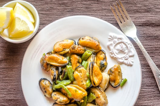 Fried mussels on the plate photo