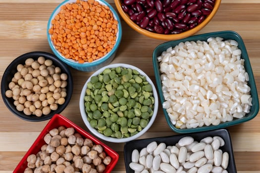 several pots with raw grains for preparing healthy food photo