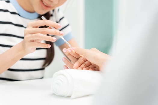 Woman receive care service by professional Beautician Manicure at spa centre. Nail beauty salon use nail file for Glazing treatment. manicurist make nail customer to beautiful. body care spa treatment photo