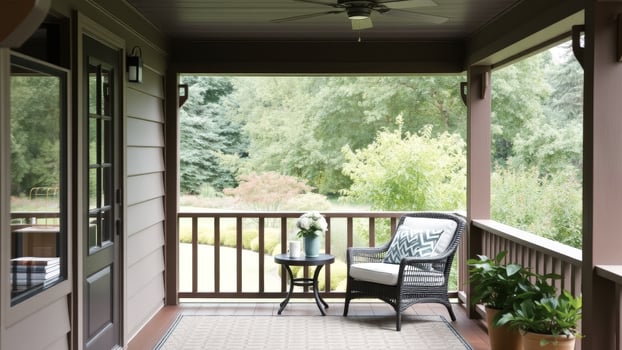 Relaxing Porch With Wicker Chair and a View of the Trees photo