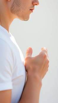 Close-up of a man's face and hand photo