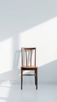 Wooden chair in minimal white room photo