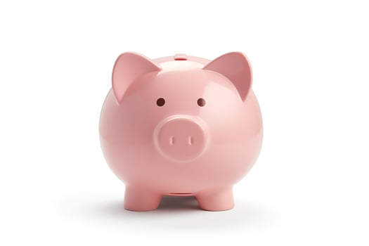 A pink piggy bank sits on a white background photo