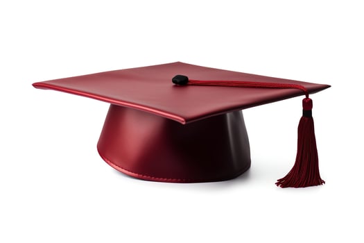 A red graduation cap isolated on a white background. photo