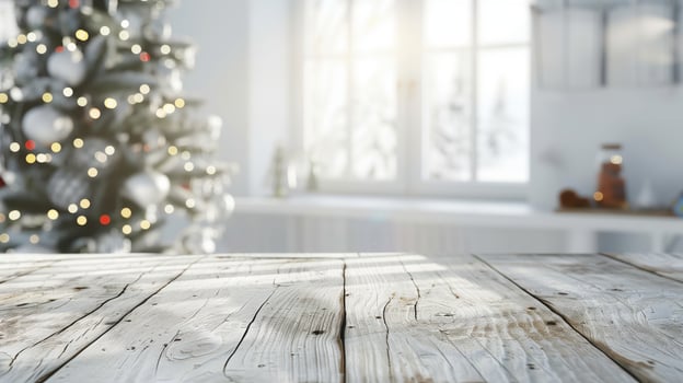 Sunlit christmas tree background behind an empty wooden table top photo