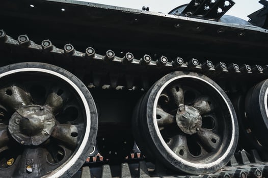 metal caterpillar track of old Soviet military tank in close-up photo