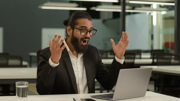 Happy positive Muslim man Indian business male employer Arabian businessman entrepreneur consultant leader manager in office win laptop achieve good result champion success victory offer opportunity photo