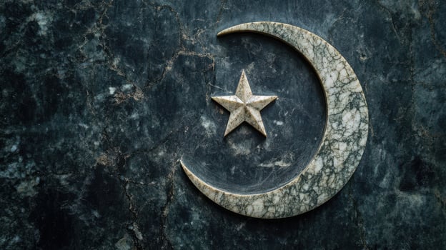 Crescent moon and star symbol on a dark marble gravestone. photo