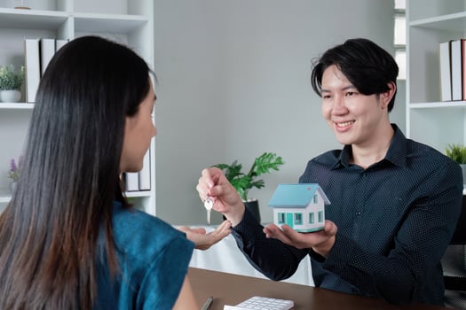 Successful real estate transaction with key exchange photo