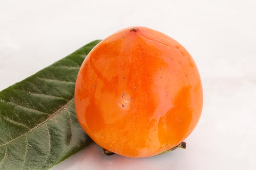 Fresh ripe sweet juicy persimmon photo