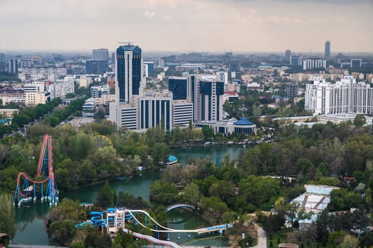 Top view of city Tashkent and aqua park from observation deck in TV tower. Tashkent, Uzbekistan - April 16, 2024 photo