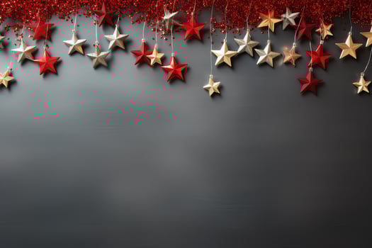 top view composition of Christmas decorations with red and silver stars on grey background. new year holiday banner copy space photo