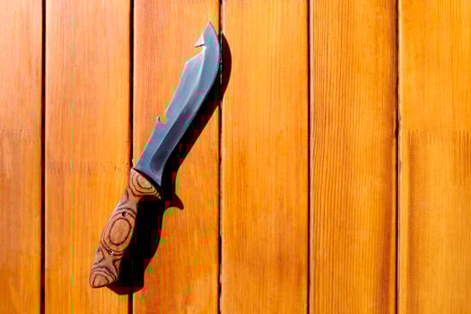Camp knife for cooking on a wooden table photo