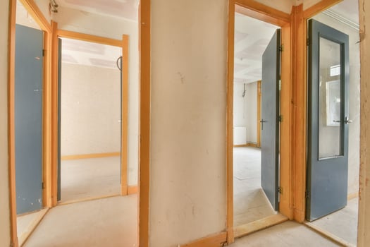 A room with two doors and a window photo