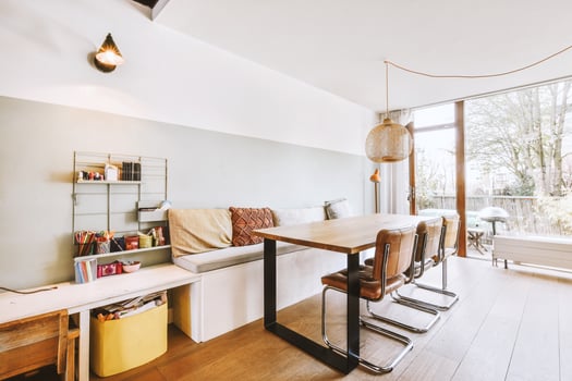 A small apartment with a table and chairs photo