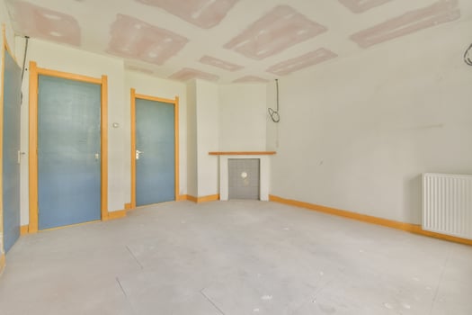 A room with a radiator and a door in it photo