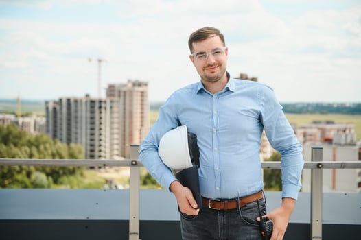 Man builder. Architect at construction site photo