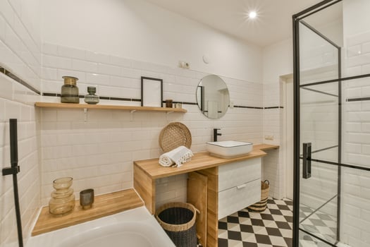 A bathroom with a black and white checkered floor photo