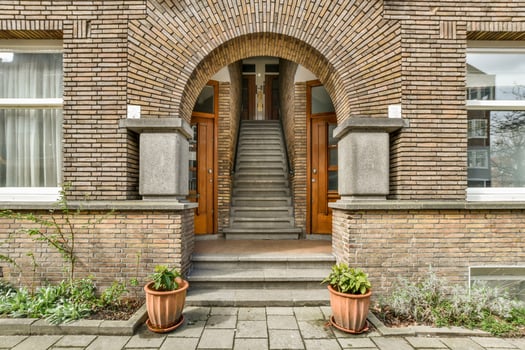 Brick building with arched door photo