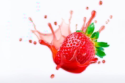 strawberry in juice splash isolated on a white background. Clipping path. photo